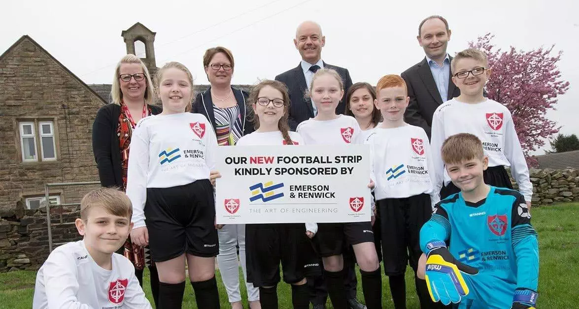 School children from Knuzden St. Oswald’s say thanks for new kit